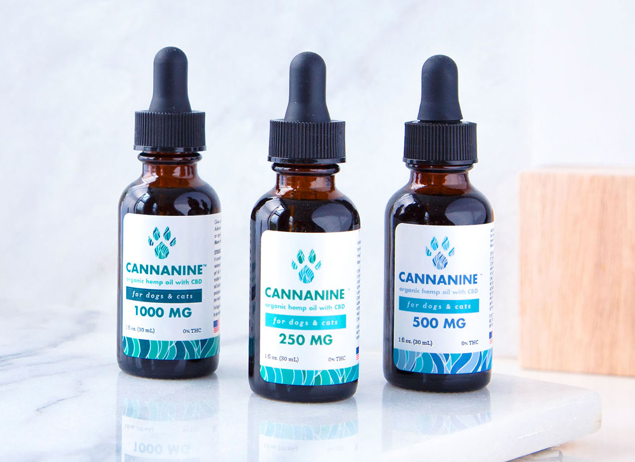 Three bottles of Cannanine Organic Hemp Oil with CBD